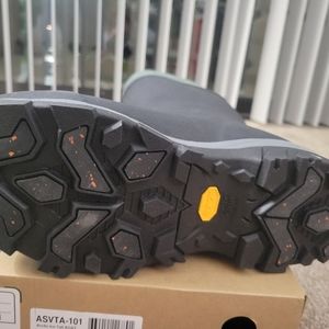 Muck all terrain articles grip boots with vibram soles.